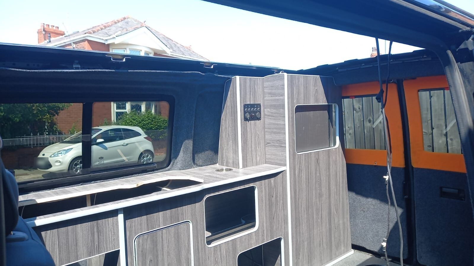 Shelves and storage space in a converted campervan