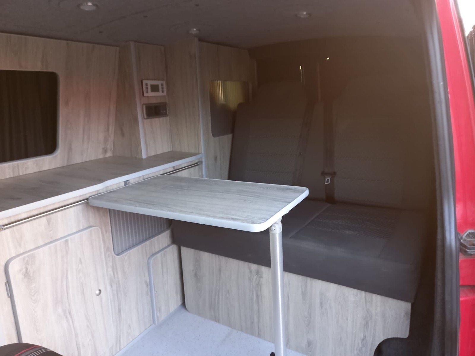 Seating and table in the red van conversion