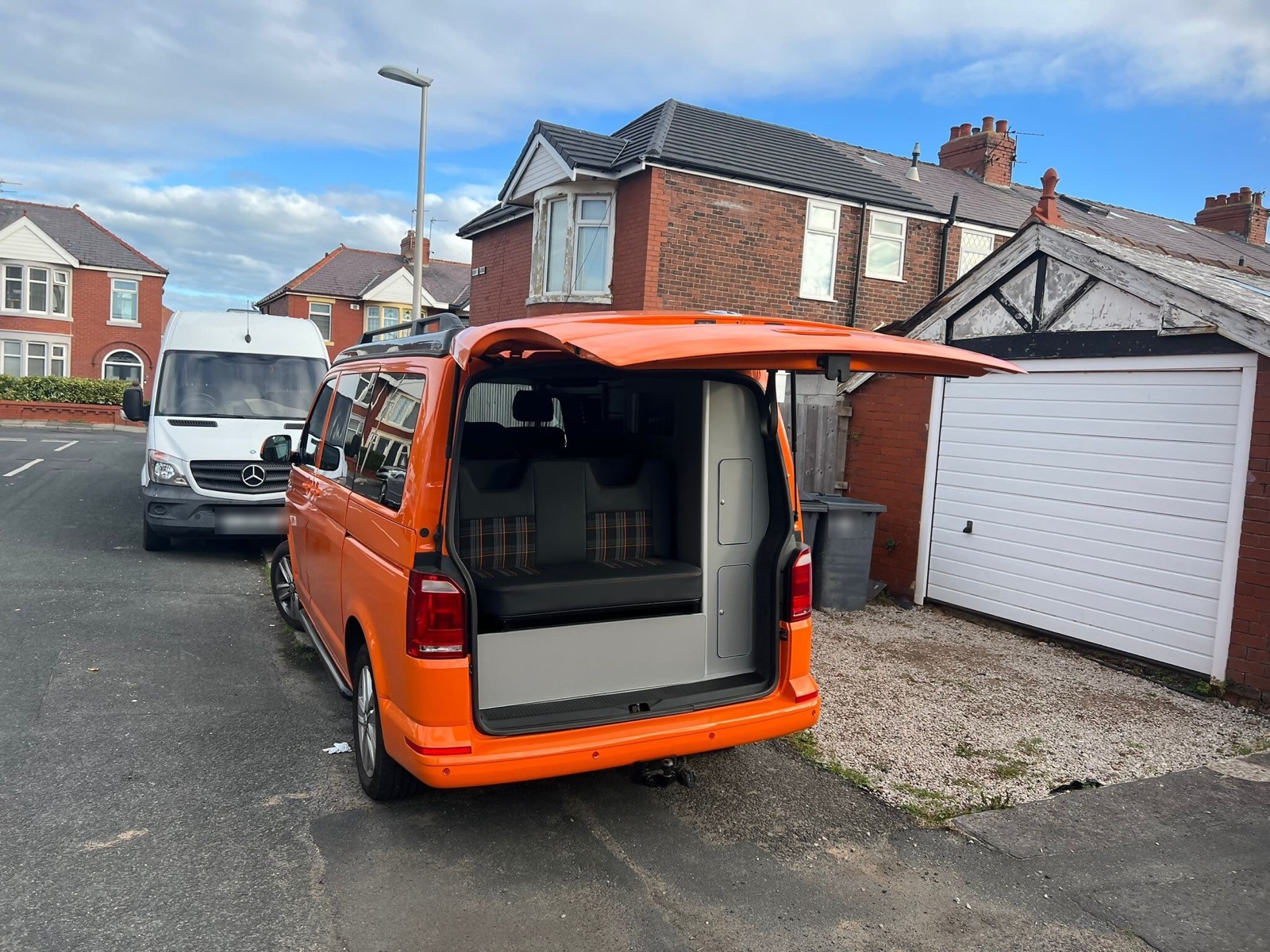 Orange van conversion with the boot open